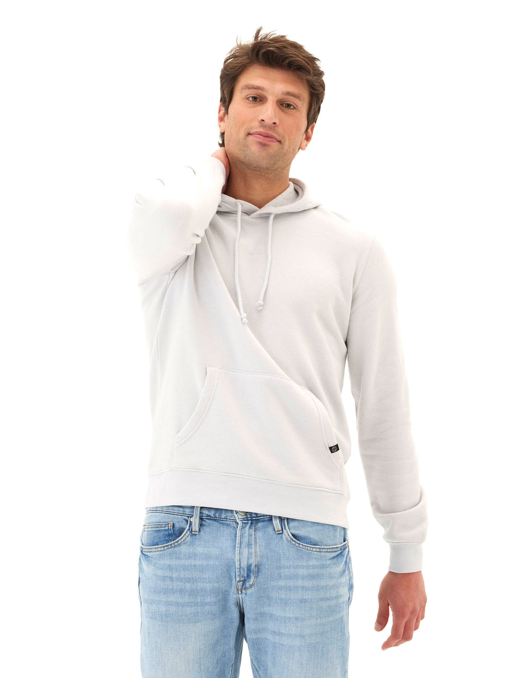 Model wearing a grey-toned mineral wash pullover fleece hoodie with a relaxed fit