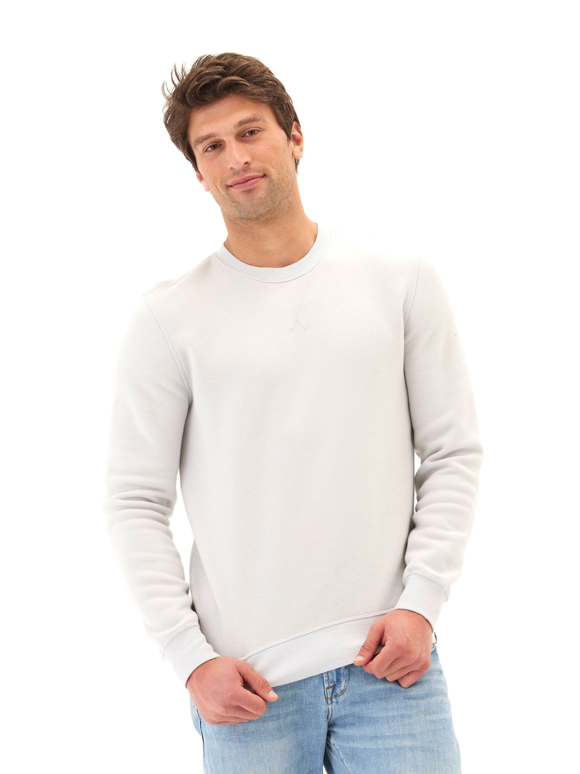 Men wearing a light-grey mineral wash fleece crewneck sweatshirt, side profile showing knit texture.