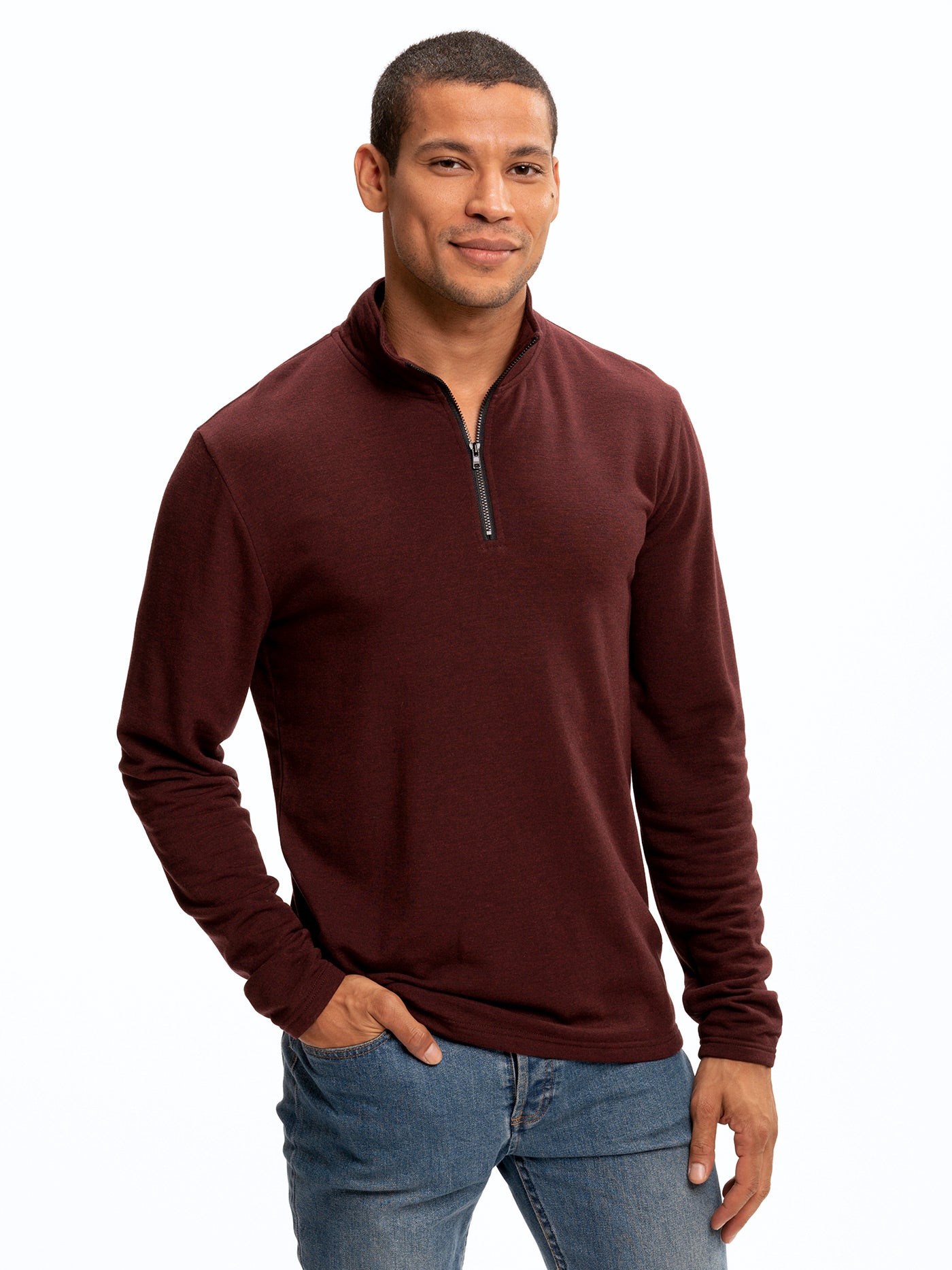 Men wearing a solid burgundy feather fleece quarter zip with a mock neck collar.