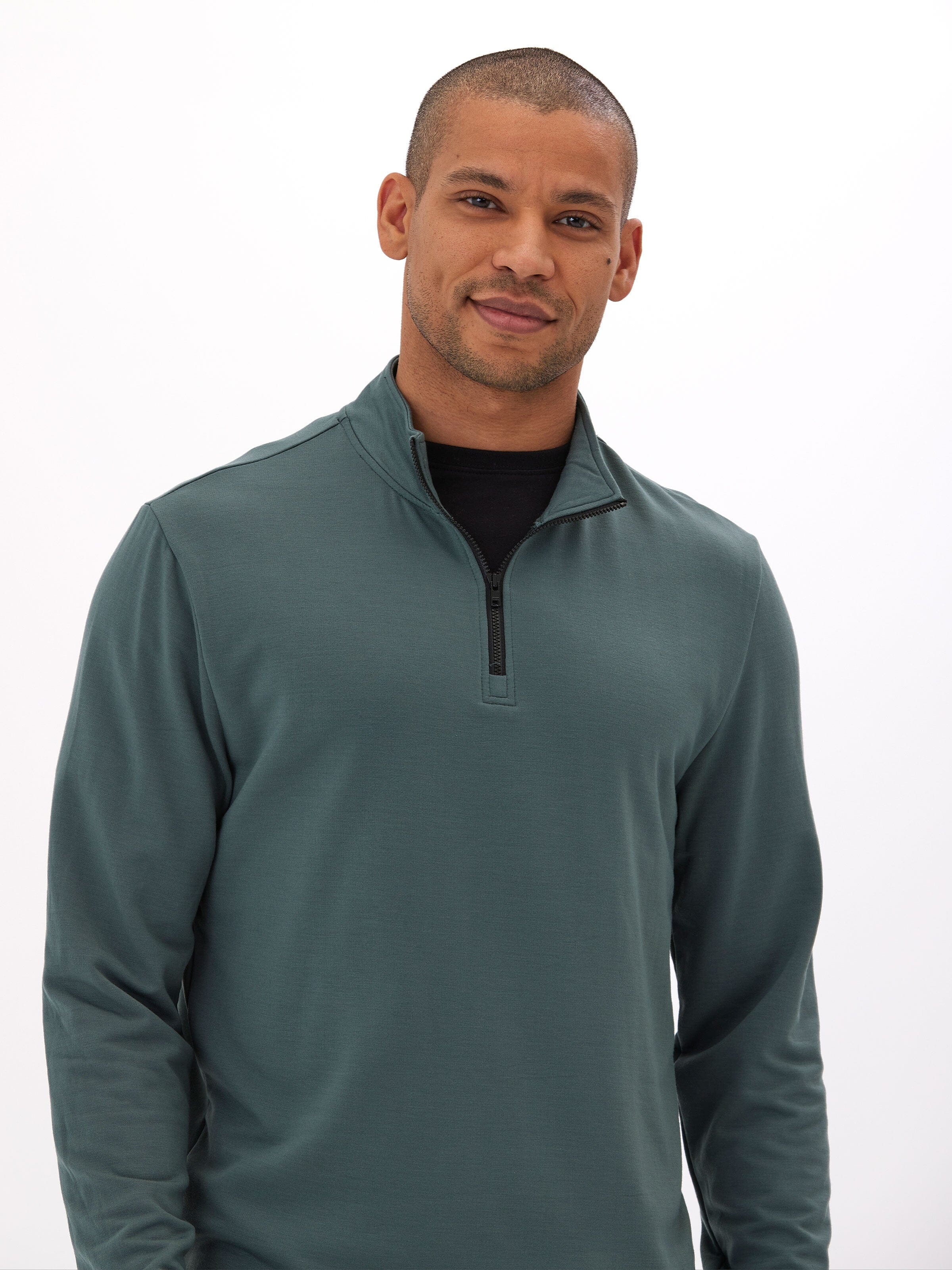 Men's Kace Modal Fleece Quarter Zip sweatshirt in solid teal green, minimalist sporty design.
