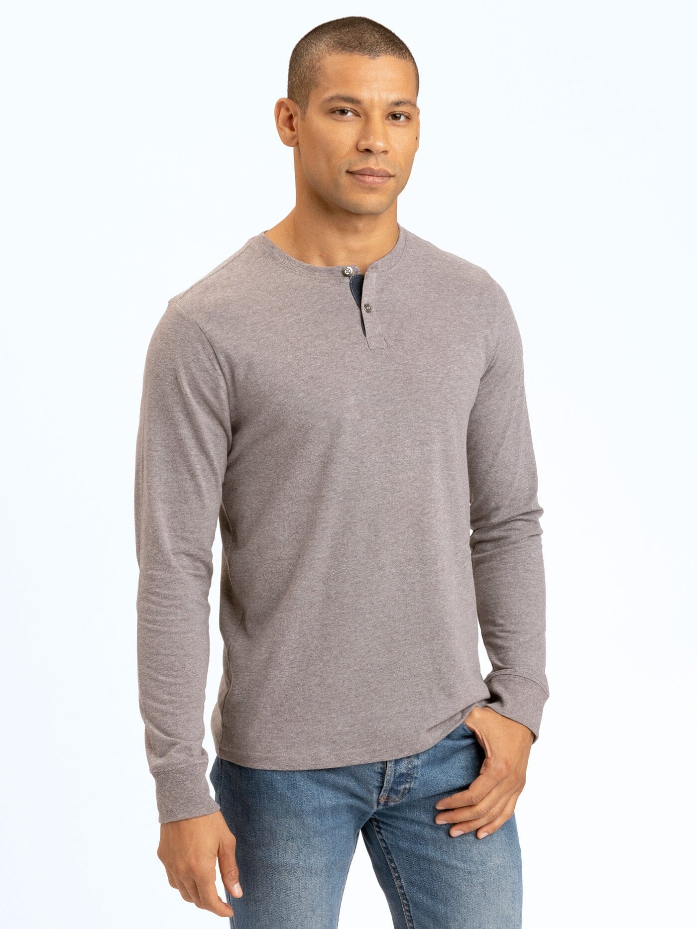 Close up of a men’s grey long sleeve henley shirt with a 2-button placket and contrast neck trim.