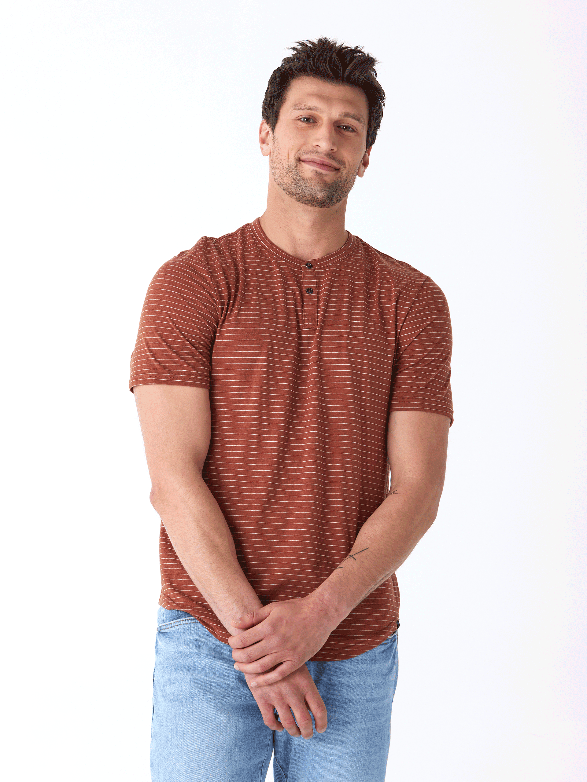 Men wearing a lightweight rust and white striped triblend jersey short sleeve henley shirt.