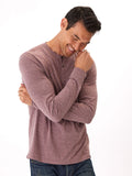Close up of a stripe pattern long sleeve henley shirt featuring a button placket