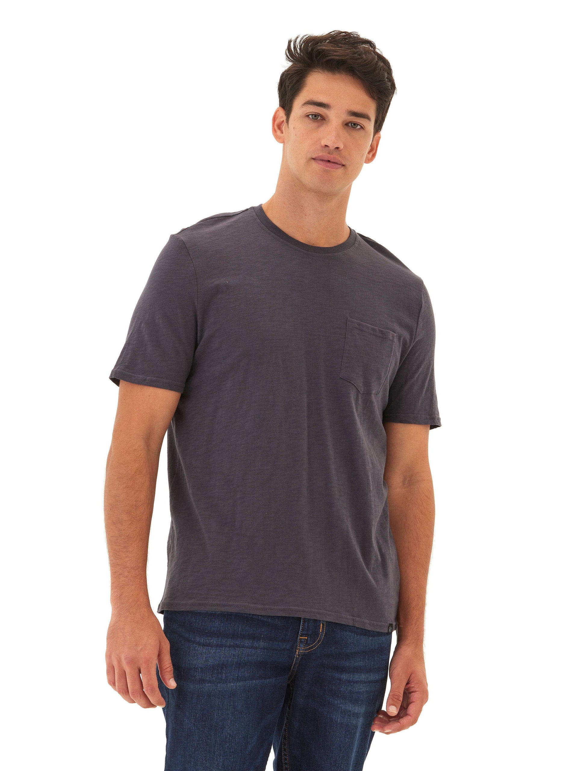 Man wearing a charcoal grey slub jersey crew neck pocket tee with a semi-fitted silhouette.