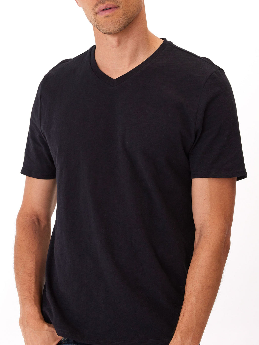 Model wearing a soft 100% organic cotton V-neck tee in a comfortable, true-to-size fit.