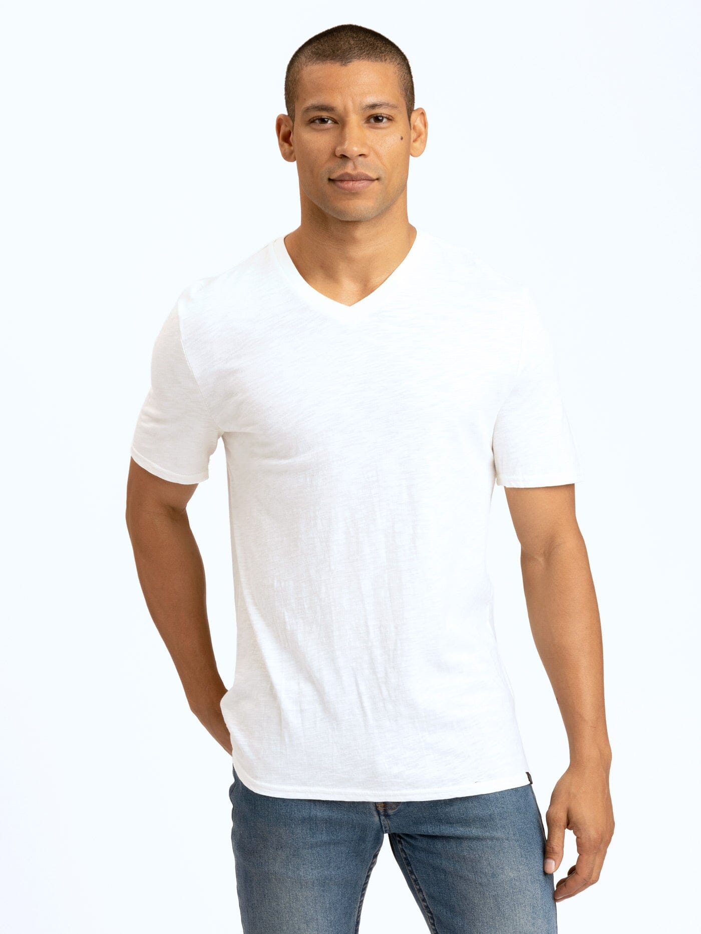 Close-up of a men's crisp white organic cotton V-neck tee with slub texture