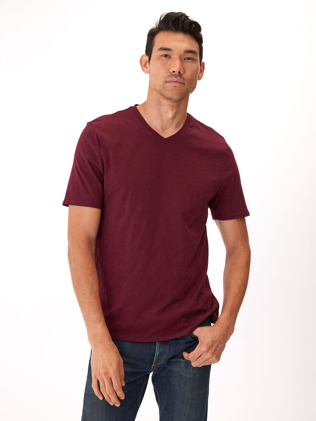 Model wearing a soft 100% organic cotton V-neck tee in a comfortable, true-to-size fit.