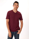 Model wearing a soft 100% organic cotton V-neck tee in a comfortable, true-to-size fit.