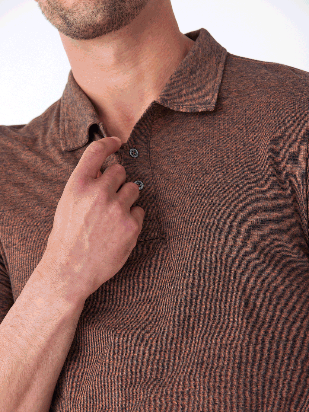 Model wearing a Black Fleck Triblend Jersey Polo with a classic fit