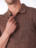 Model wearing a Black Fleck Triblend Jersey Polo with a classic fit
