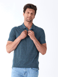 Close up of Black Fleck Triblend Jersey Polo showing textured fabric detail and classic collar