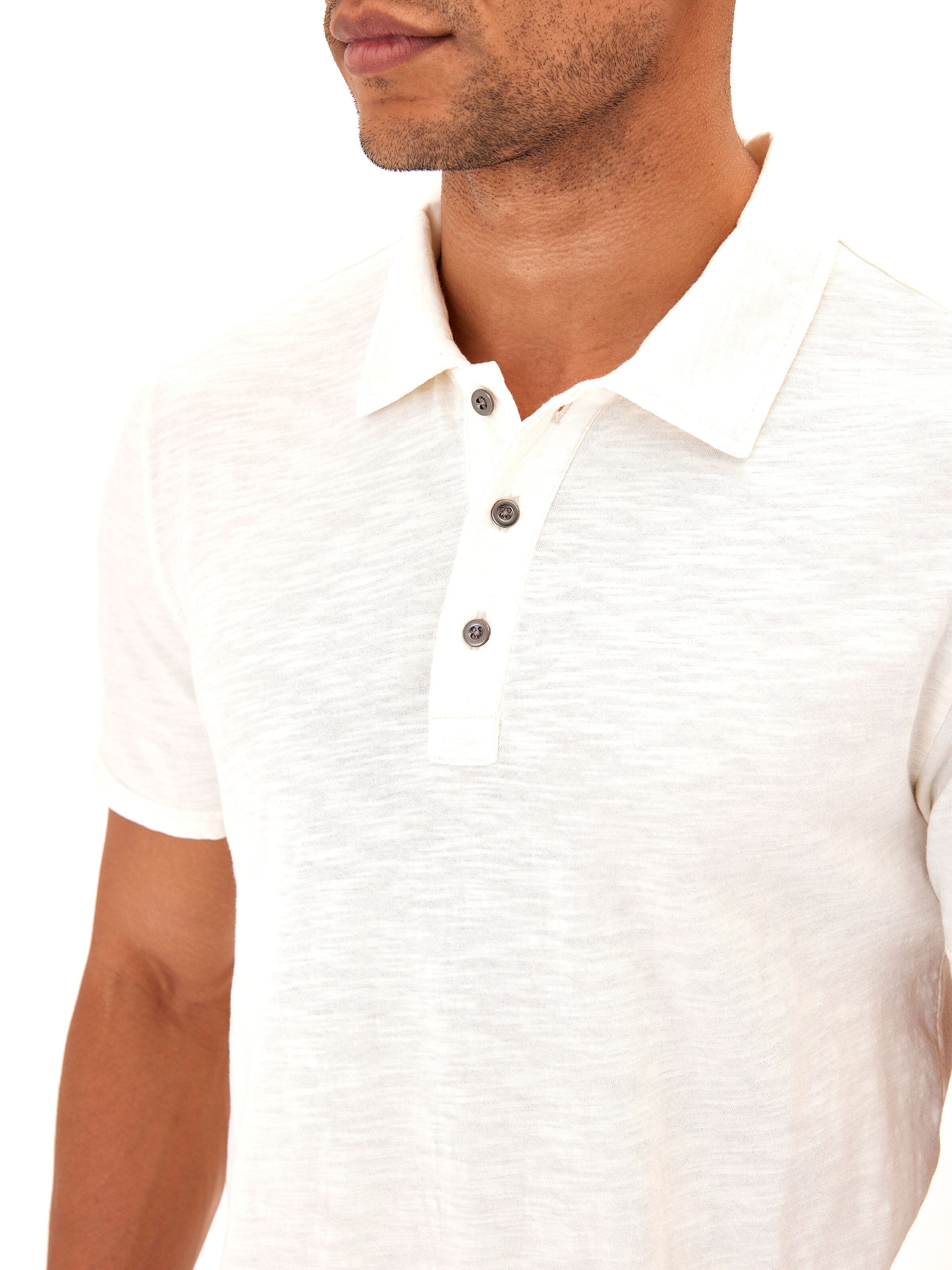 Minimalist men's off-white organic cotton slub jersey polo shirt.