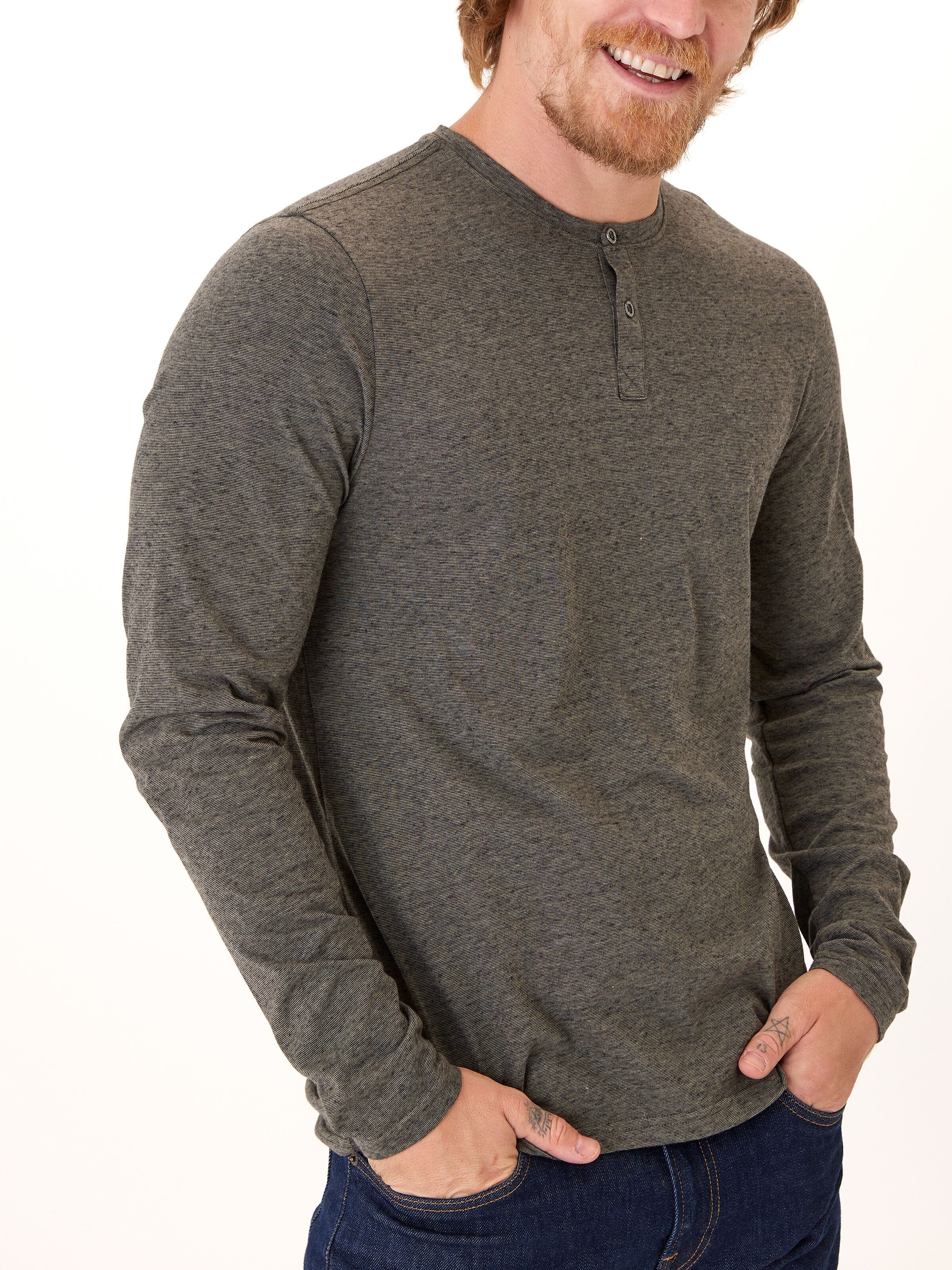 Braeden long sleeve black fleck triblend henley shirt on a neutral background