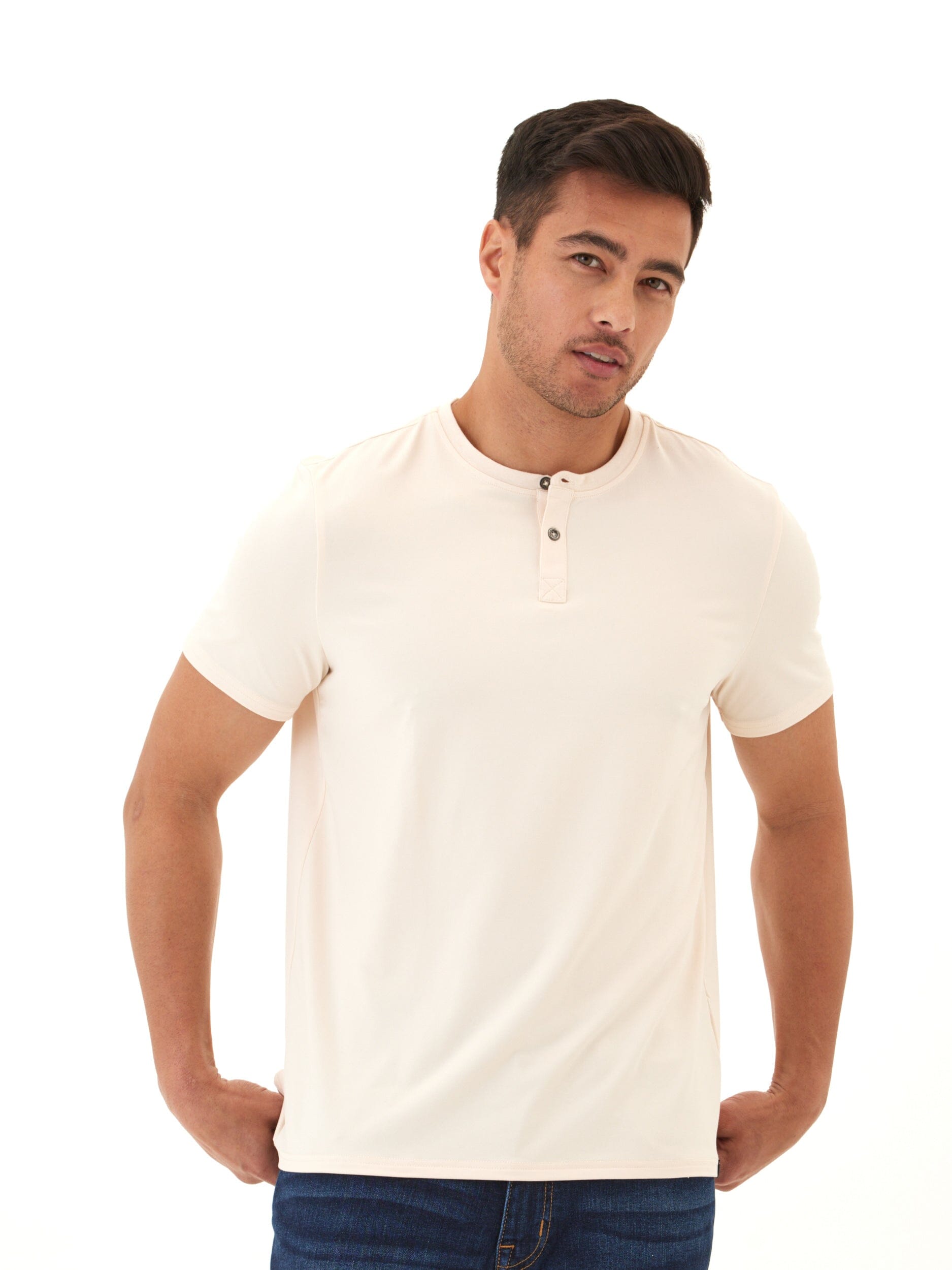 A men's cream-colored 2-button henley shirt made from soft knit jersey fabric.