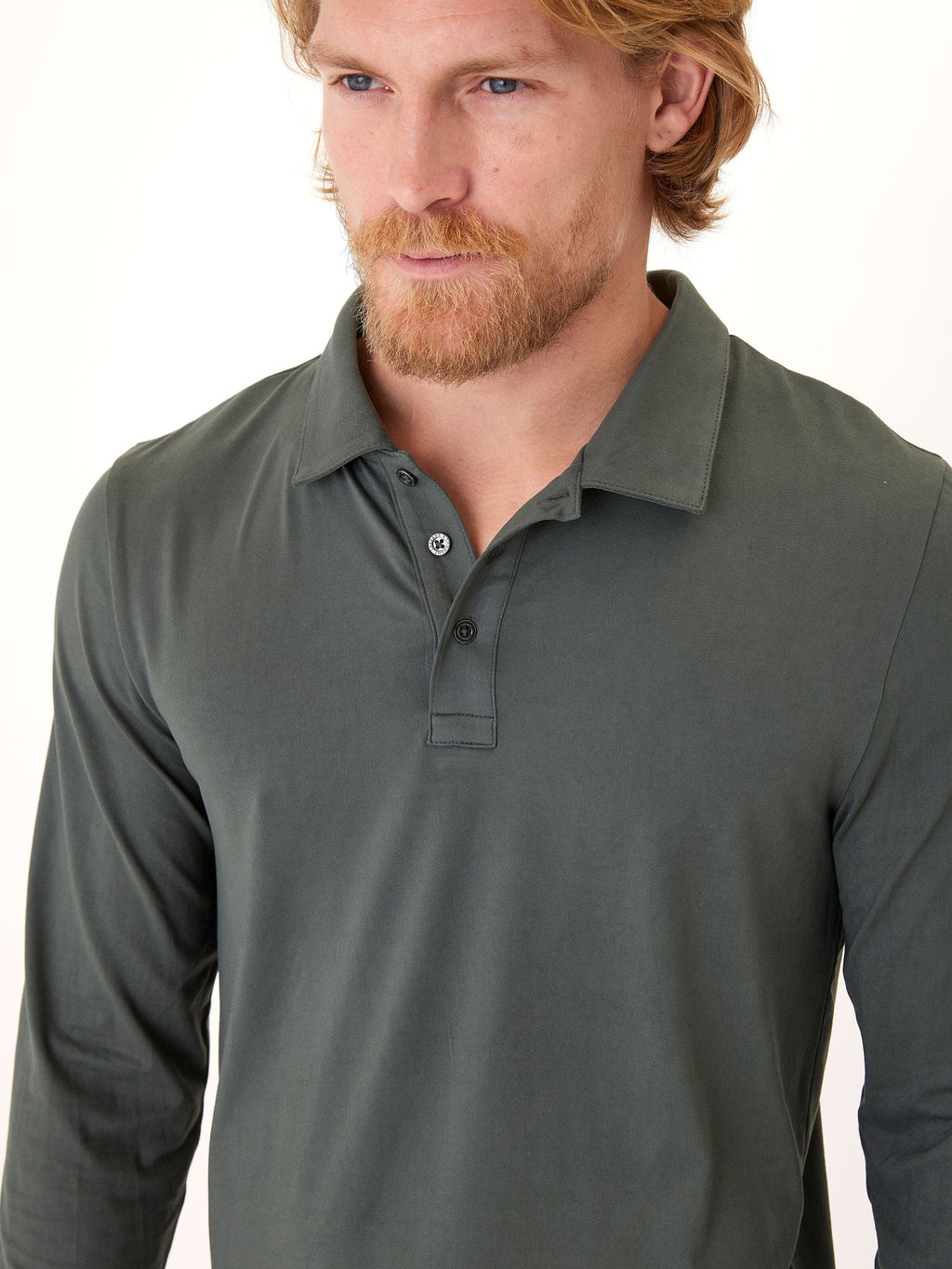 Close-up of Luxe Jersey Long Sleeve Polo featuring soft stretch fabric and classic collar design.