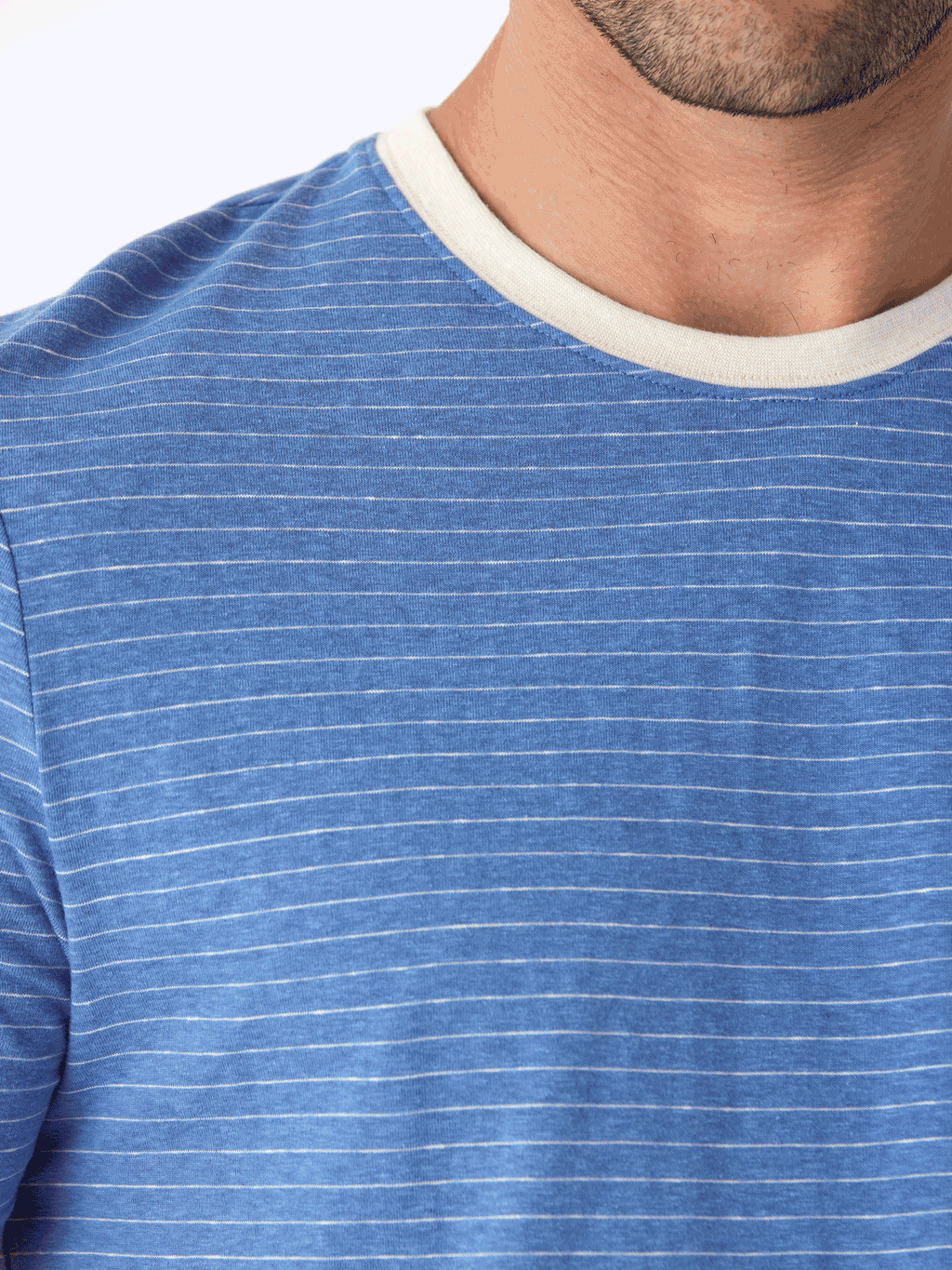 Close up of a striped triblend jersey crew neck t-shirt with elevated neck detail
