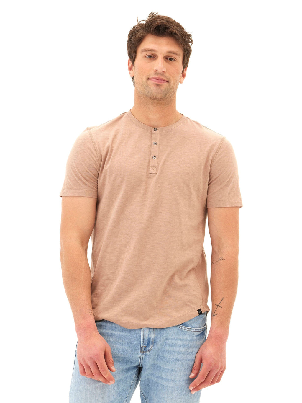 Men wearing a tan Heath Slub Jersey Short Sleeve Henley with three-button detail.