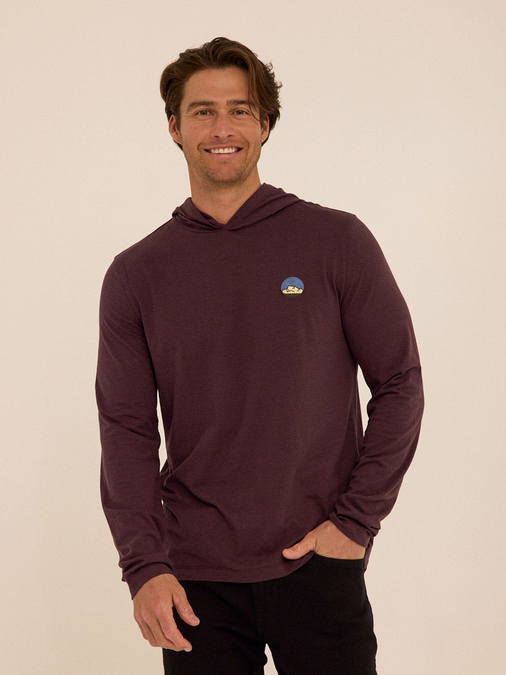 Long sleeve eco-triblend hoodie tee with minimalist chest embroidery detail