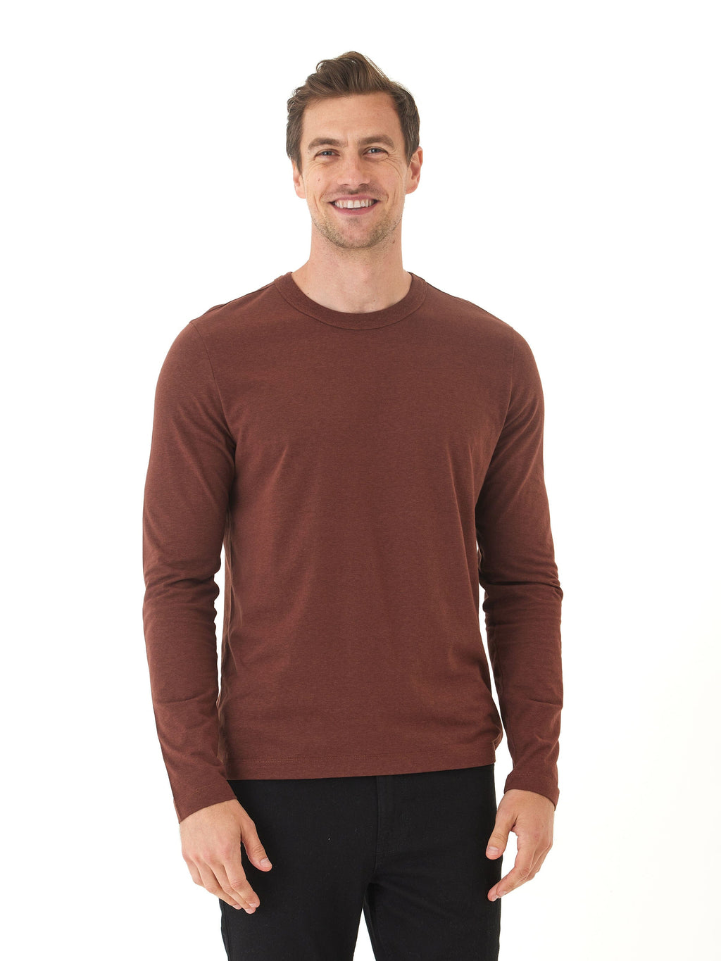 Men wearing a solid brown long sleeve triblend crew neck shirt with a minimalist design.