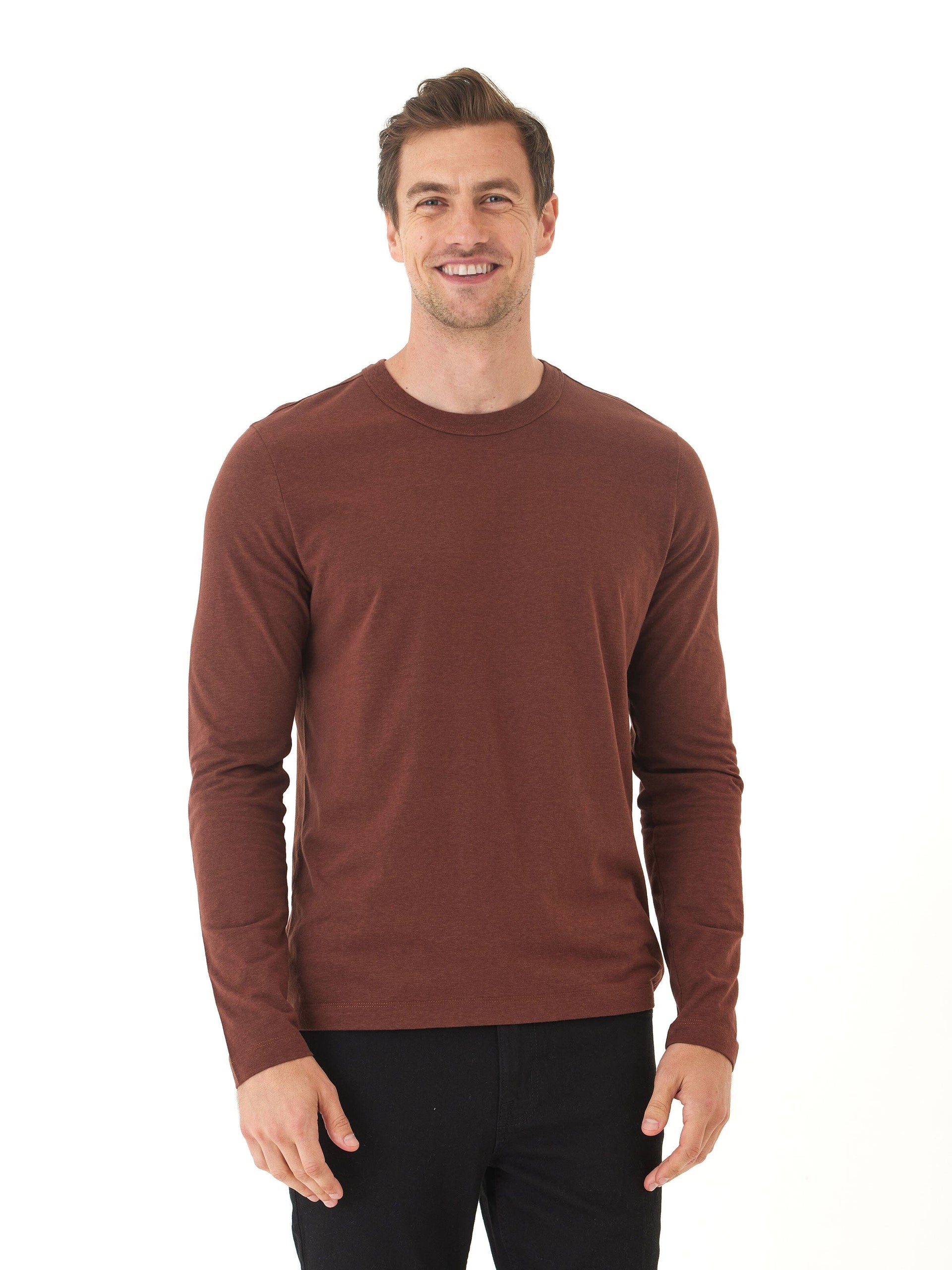 Men wearing a solid brown long sleeve triblend crew neck shirt with a minimalist design.