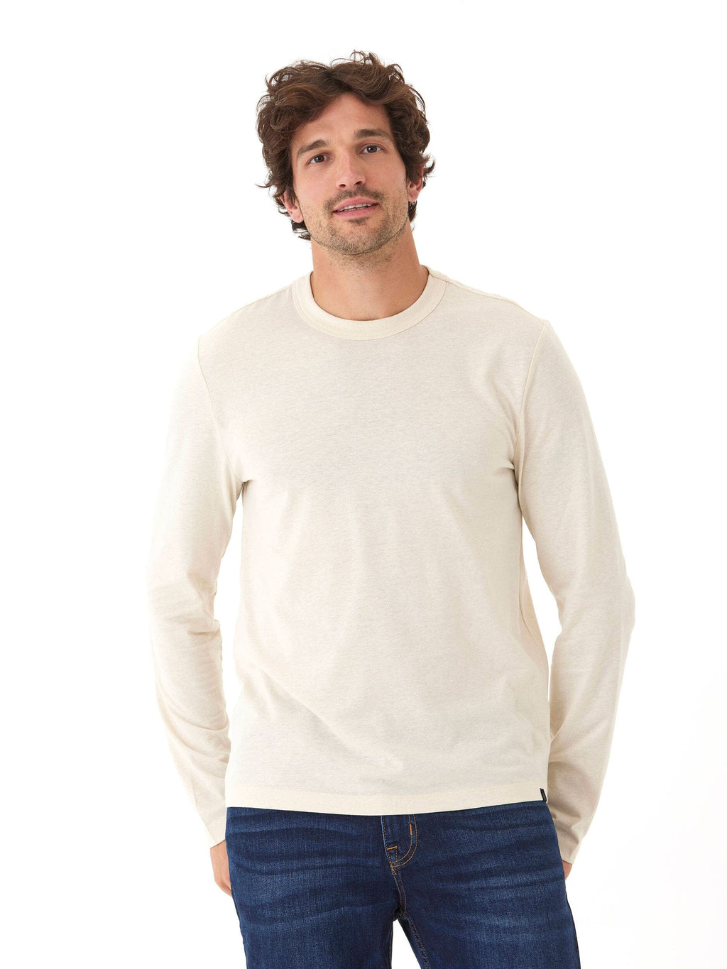 Men wearing a neutral off-white long sleeve crew neck knit shirt with a classic regular fit.