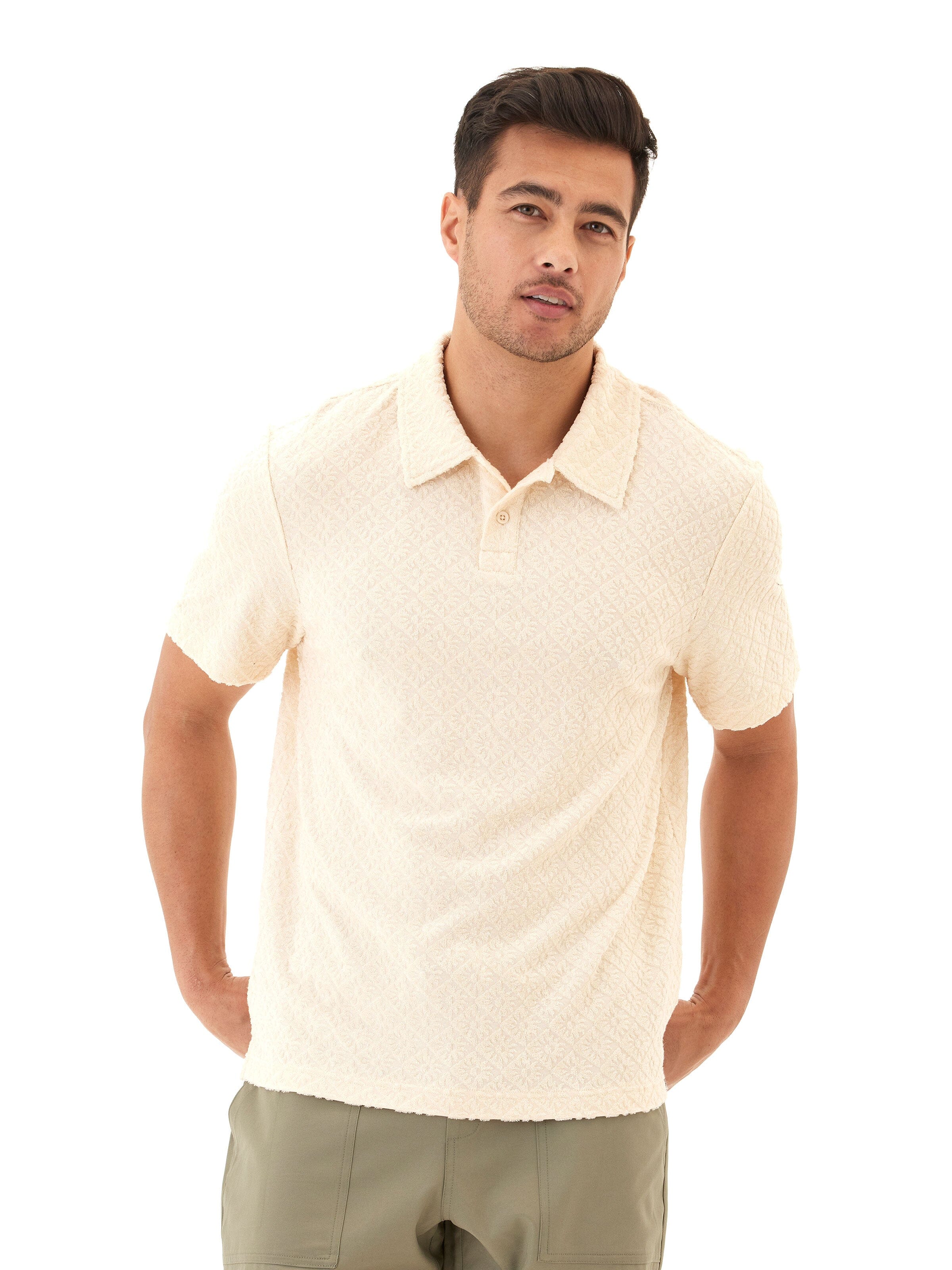 Close-up view of the Darryn Jacquard Terry 2-Button Polo in Cream featuring geometric knit texture