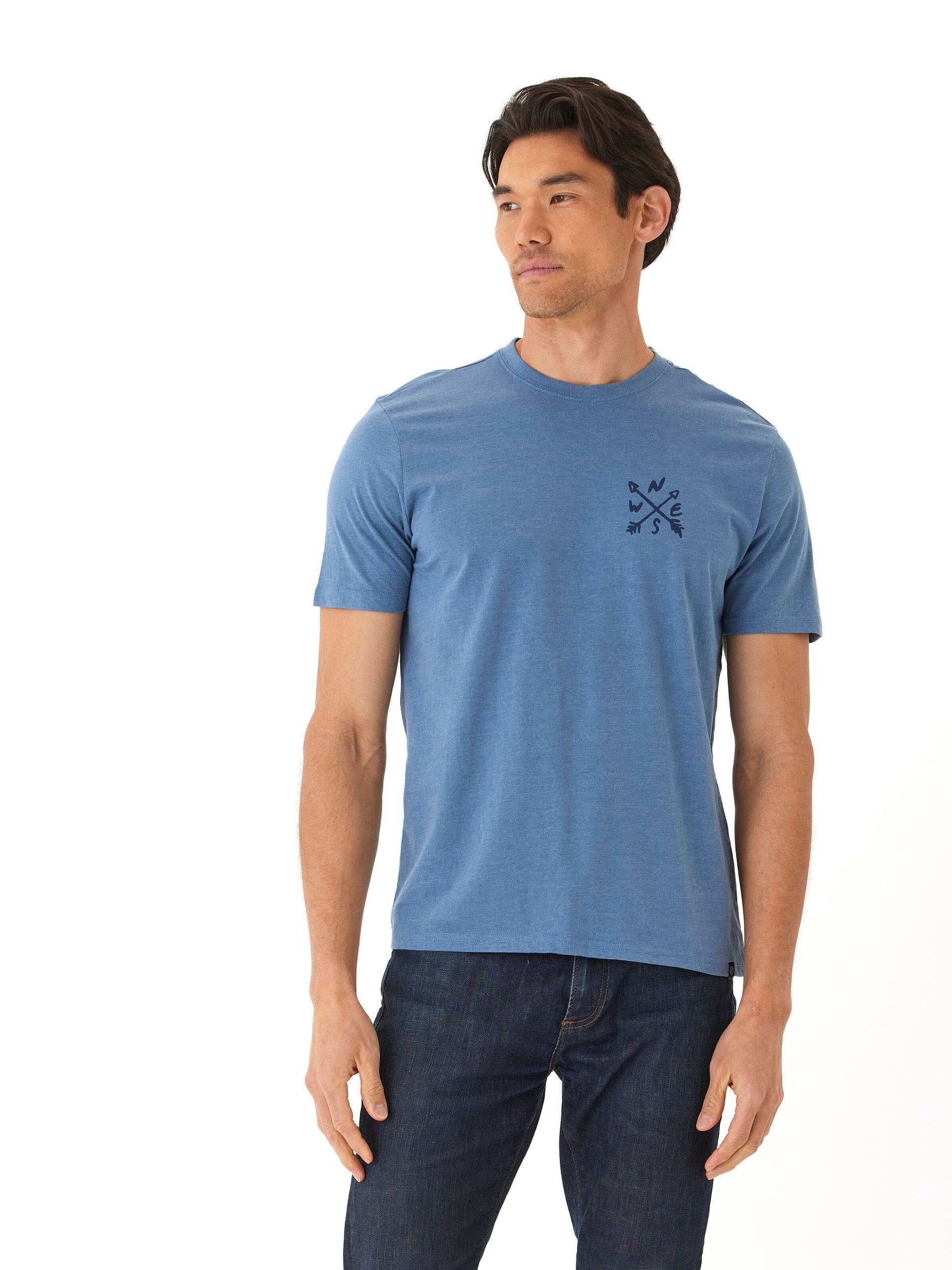 Men wearing a soft wash graphic tee in navy, made from organic cotton blend.