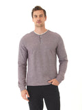 Men wearing a solid maroon Charles Eco Double Knit Henley with a three-button placket and ribbed cuffs.