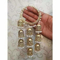 Gold-tone three-step jhumka latkan bangle adorned with white hanging pearls