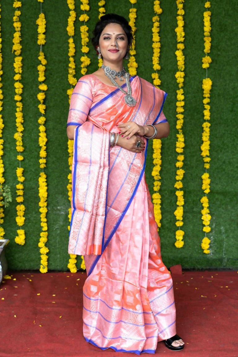 Baby pink soft handloom silk saree with intricate gold zari woven details and matching blouse