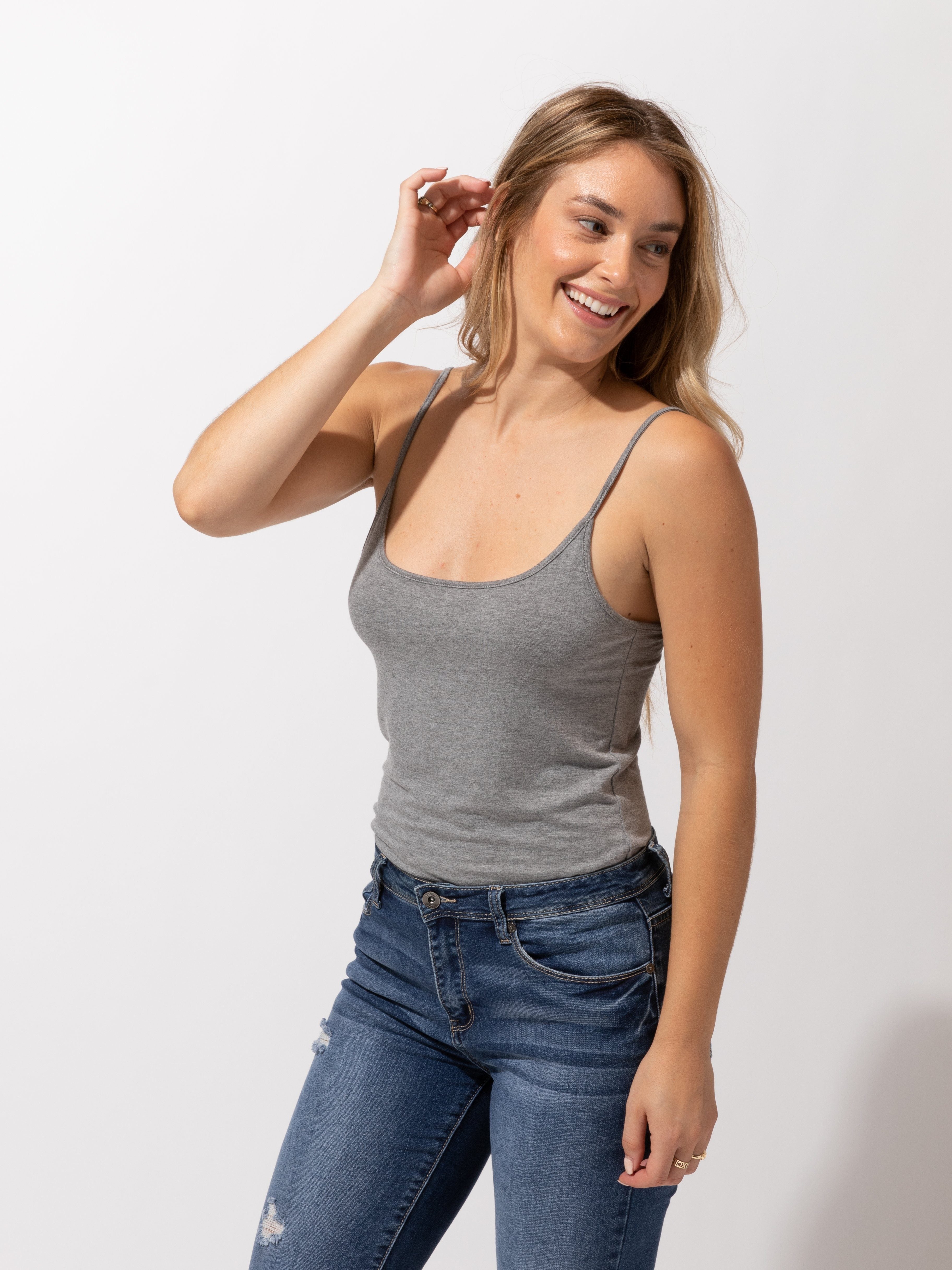 Women's minimalist solid grey knit cami tank top worn as a casual staple piece