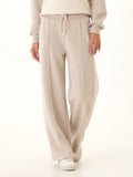 Beige and cream colorblock wide-leg lounge pants in soft triblend fleece.