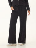 Model wearing comfortable Latricia cotton blend terry wide leg pants with back patch pockets