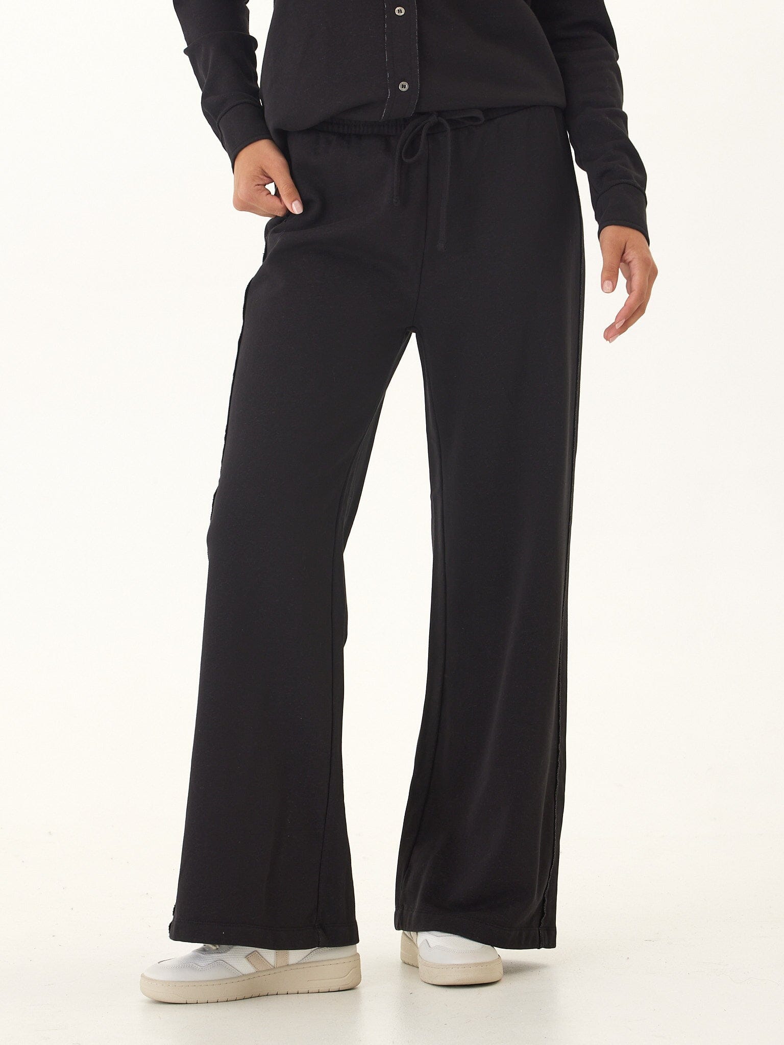 Model wearing comfortable Latricia cotton blend terry wide leg pants with back patch pockets