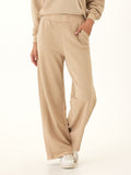 High-rise wide-leg Core Feather Fleece sweatpants in warm beige, shown in a relaxed lounge fit.