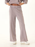 Core Feather Fleece sweatpants in mauve and dusty-purple with a relaxed knit finish.
