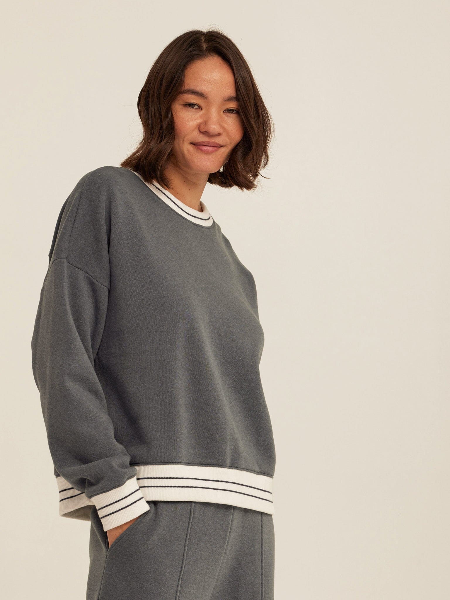 A relaxed fit Jahmeera Triblend Fleece Collegiate Pullover with contrast rib trim.