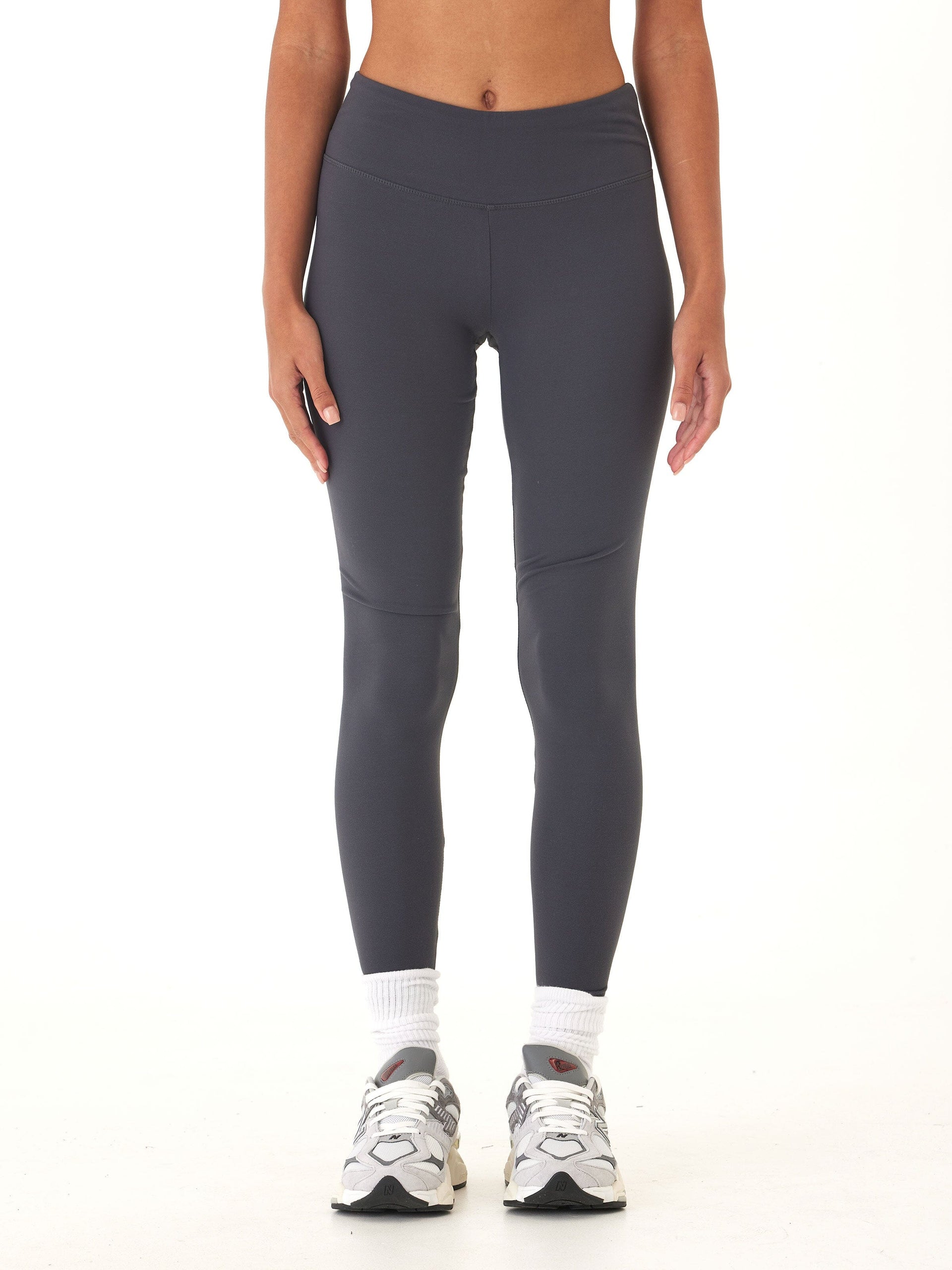 Woman wearing charcoal grey Monica mid rise full length 26-inch performance leggings