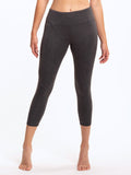 Model wearing dark heathered charcoal grey Monica 21 inch cropped leggings with a minimalist sporty design.
