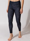 Model wearing Monica 28-inch high-rise athletic leggings in black and charcoal camo print