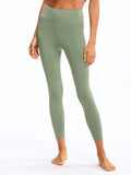 Rita High Rise 7/8 Sport Legging in sage green with side pockets and flat-lock seams.