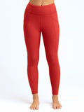 Rita 7/8 high rise sport legging with side pockets and flat-lock seams in recycled performance fabric.