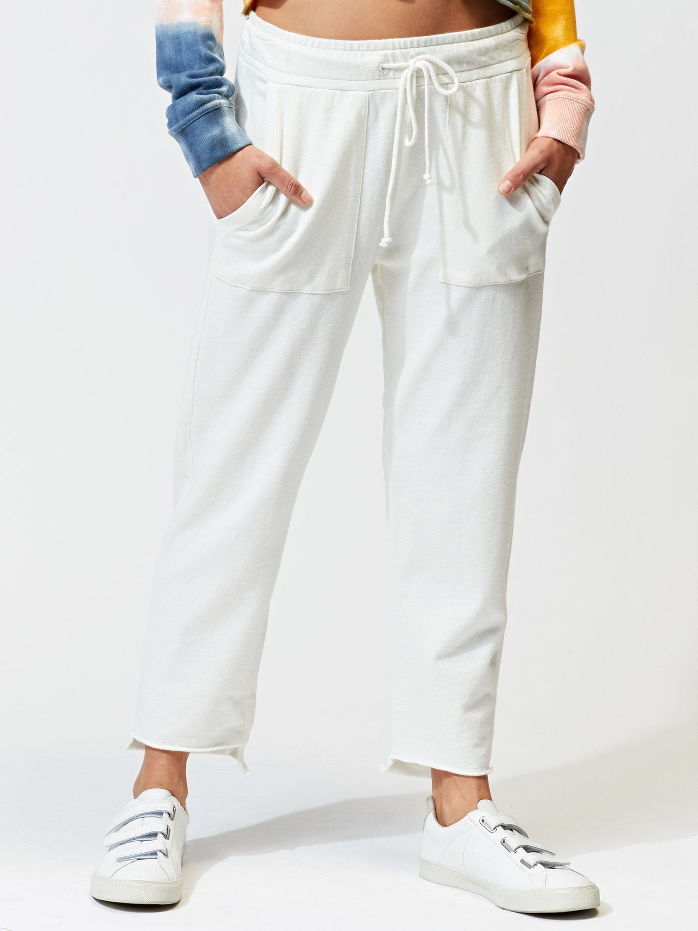 Women's white Romilly jogger with asymmetrical step-hem detail