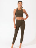 A pair of olive green high-waist ribbed leggings in a minimalist athletic style