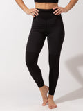 Woman wearing black Mikayla full-length leggings featuring a subtle silver waistband logo