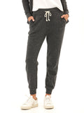 Slim fit triblend jogger in charcoal with side pockets and a drawstring waist, styled for an athleisure look.