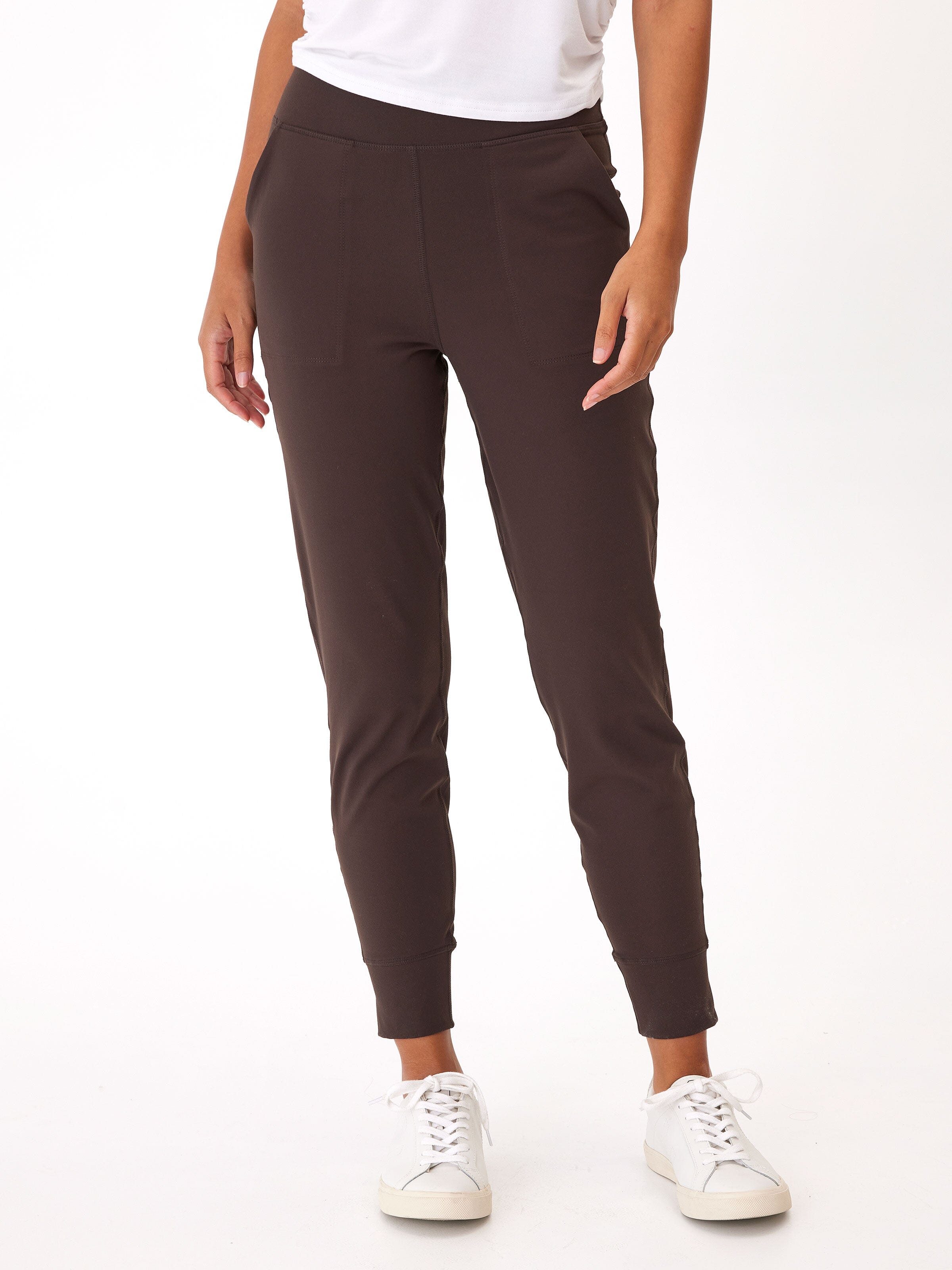 Side profile of the Lydia Jogger in Peached Performance Jersey featuring side pockets and a comfortable elastic waistband.