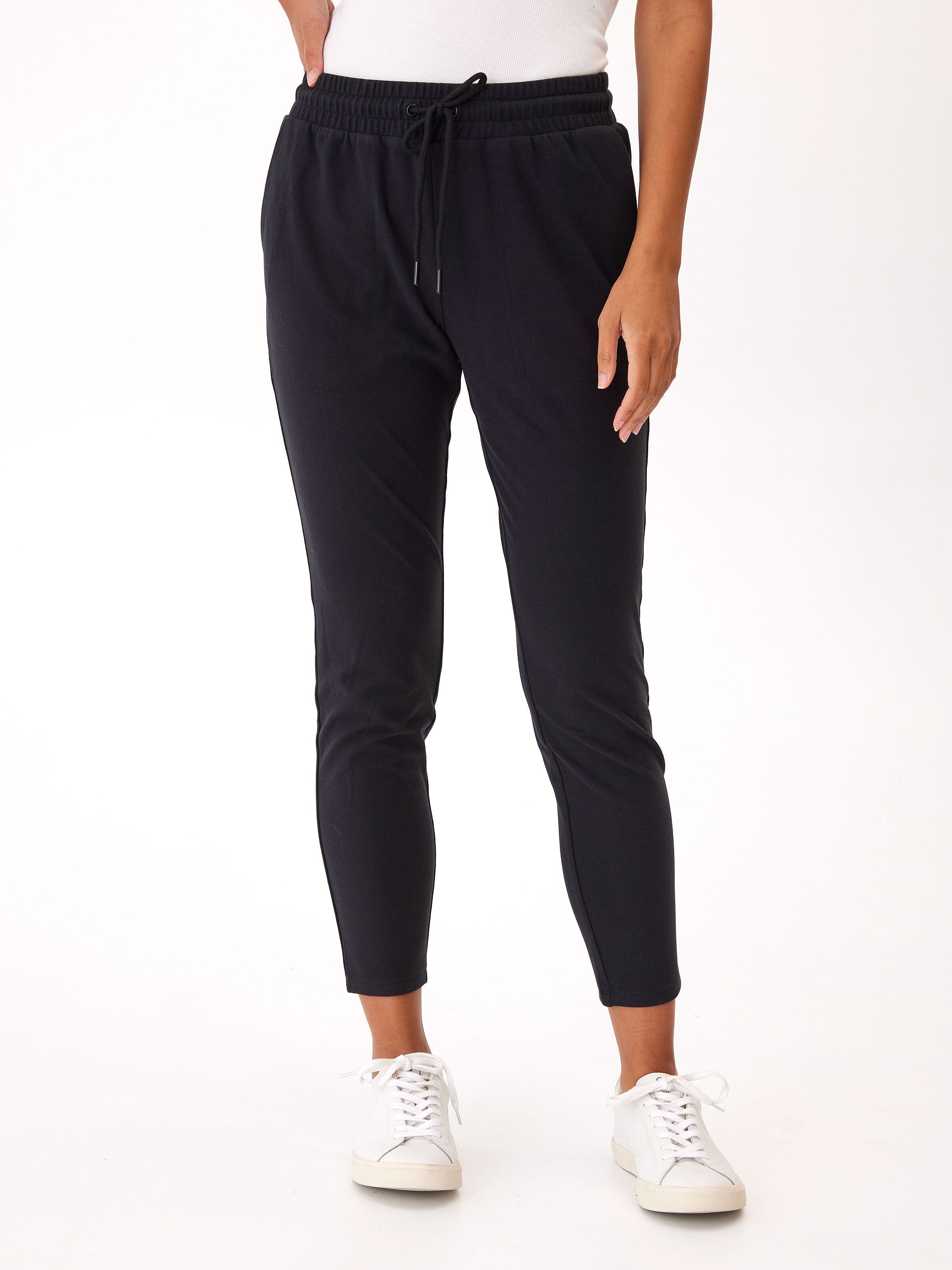 A pair of women's black Lacey Luxe Fleece Joggers with a tapered ankle and mid-rise elastic waistband.