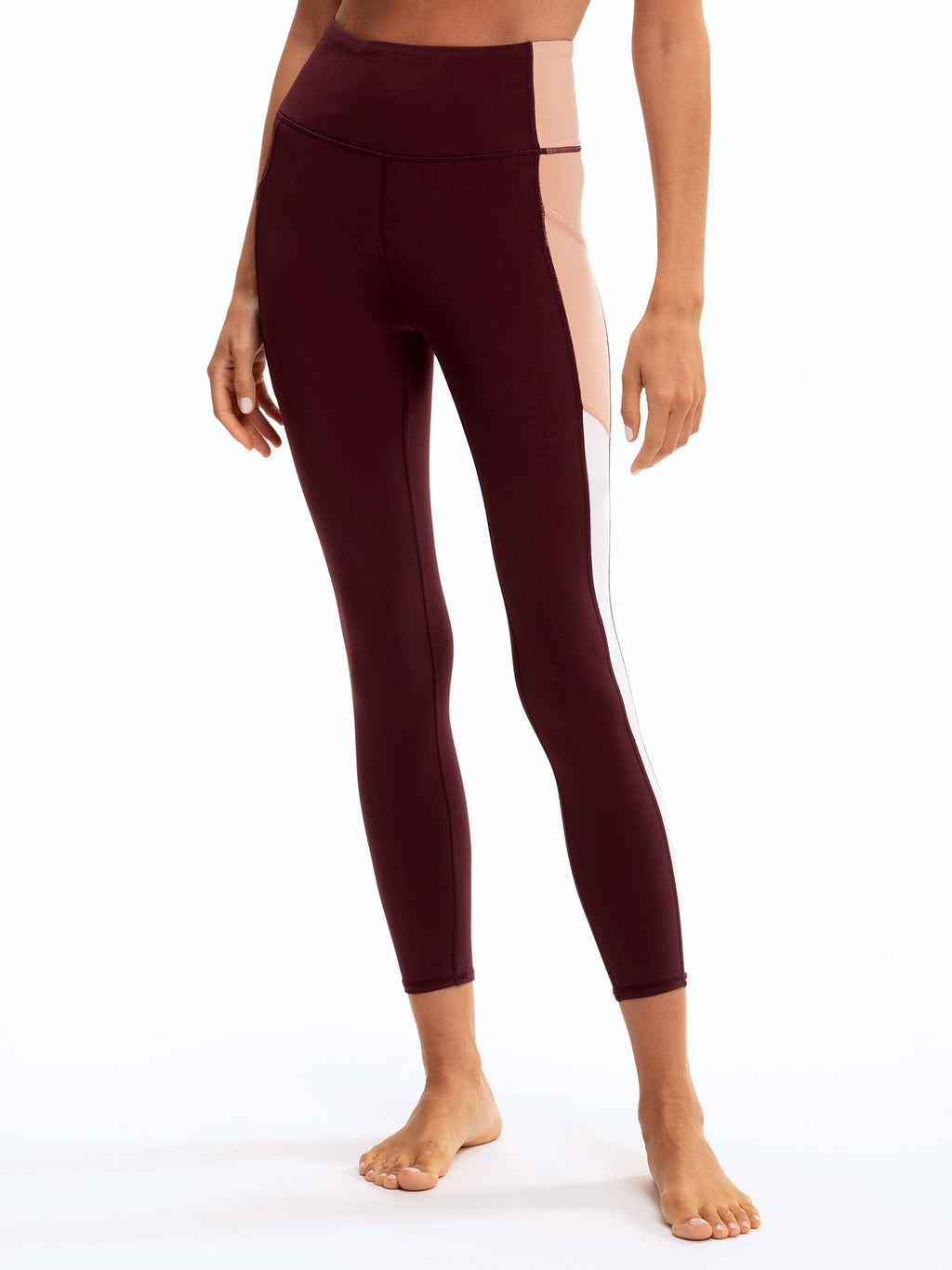 Saskia colorblock leggings in deep burgundy and soft blush-pink with high-rise waist and cell phone pocket.