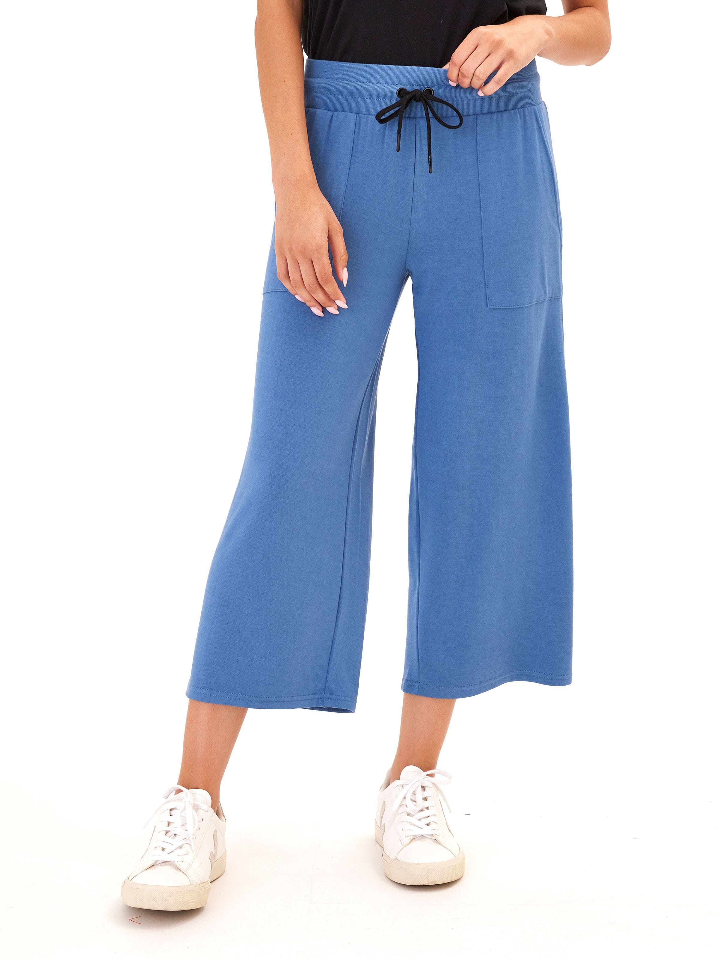 A pair of women's blue feather fleece wide-leg cropped lounge pants shown on a neutral background.